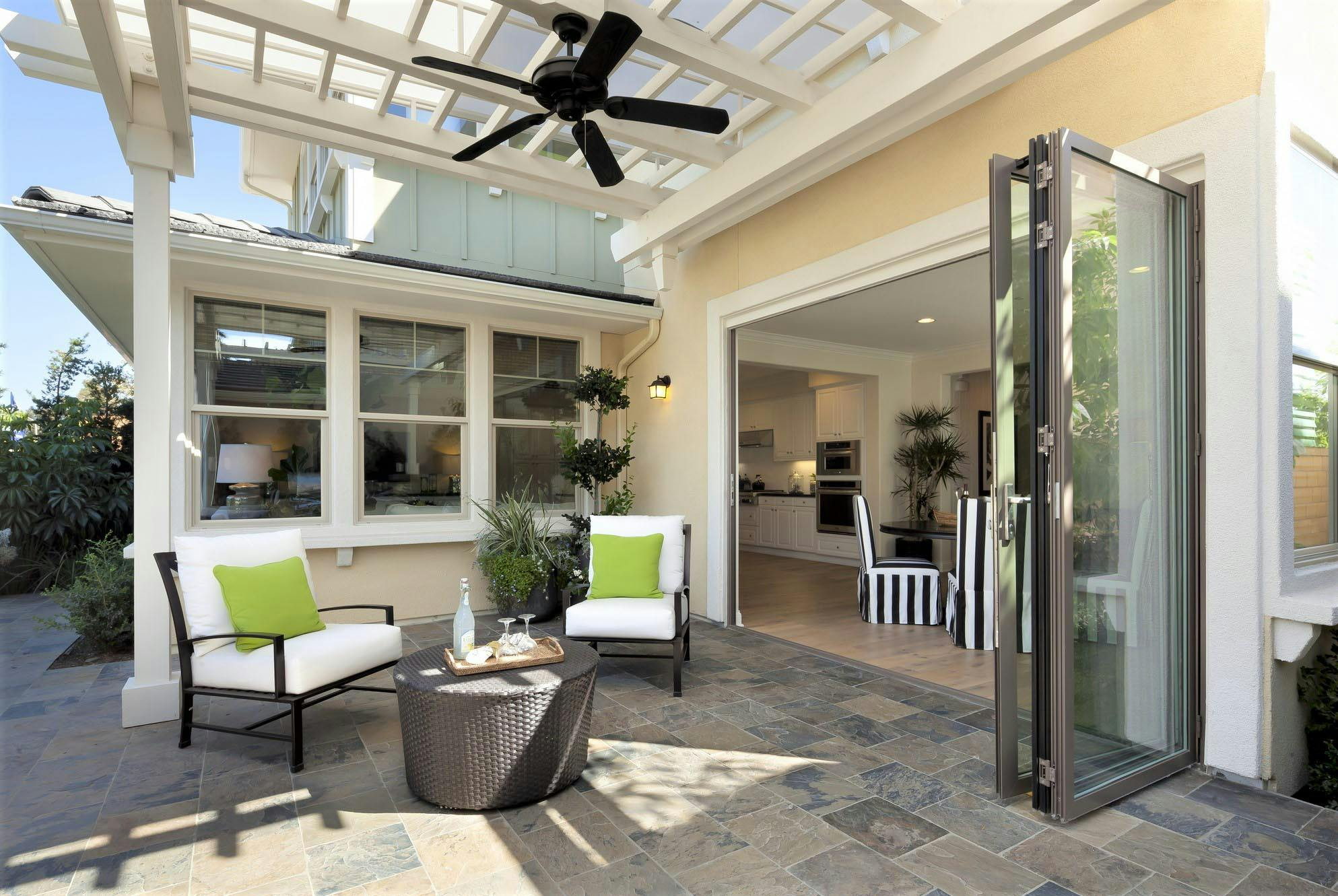 replacing traditional patio doors with folding glass walls