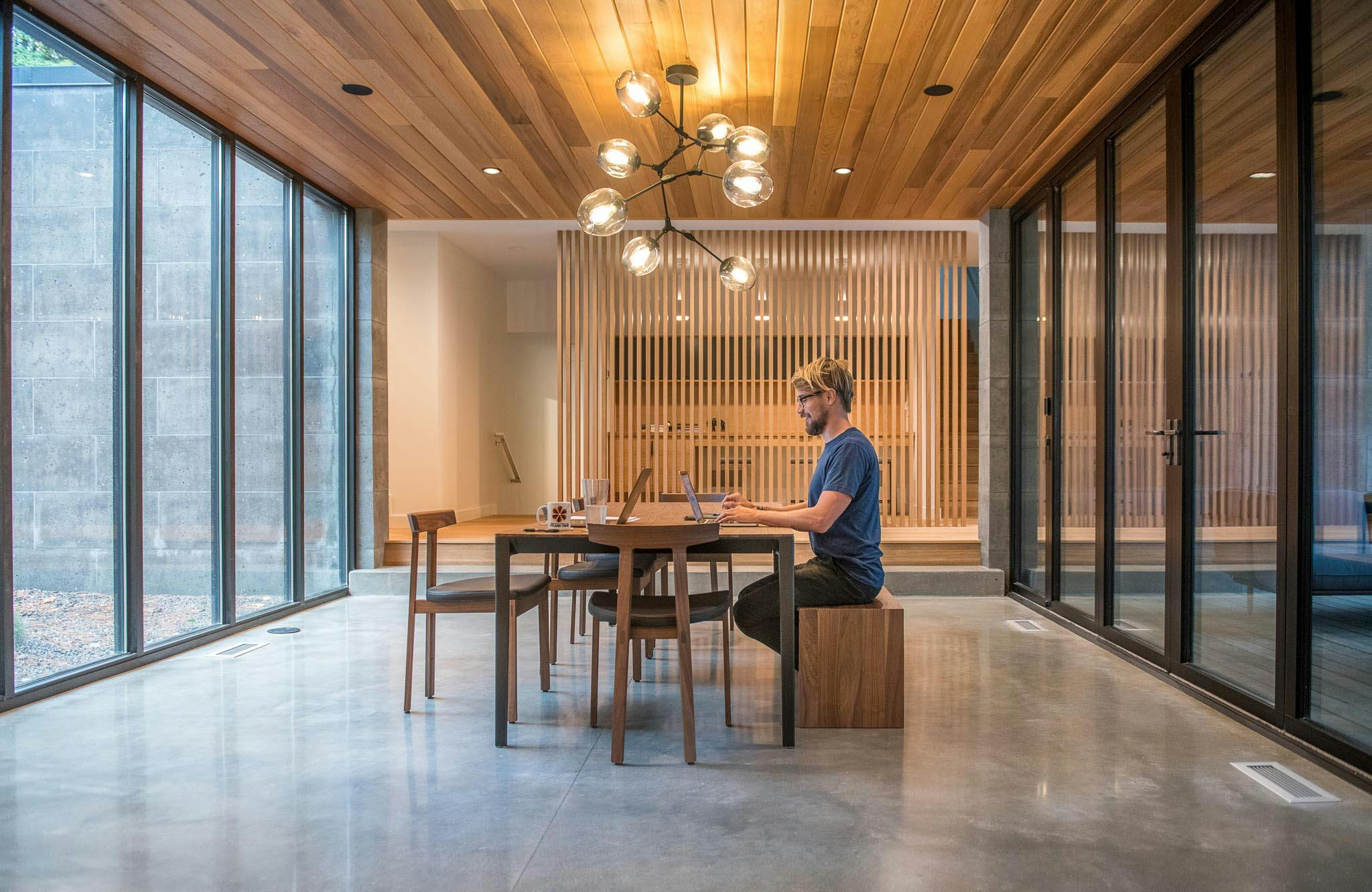dining room becomes flexible work from home room with folding glass wall