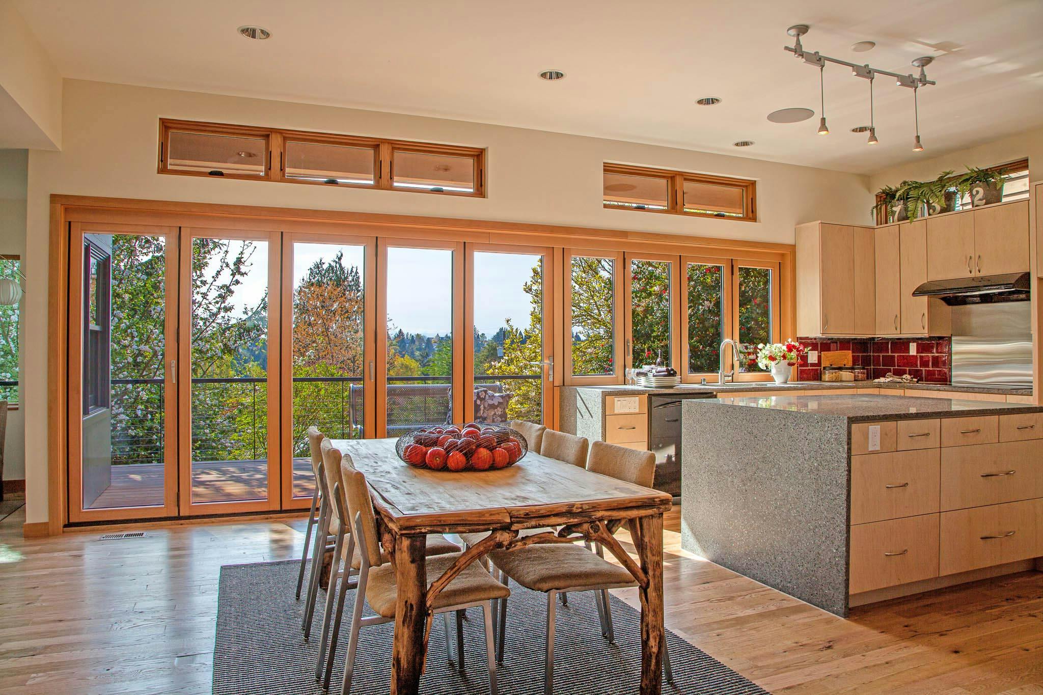 opening glass walls kitchen transition in wood in Seattle home