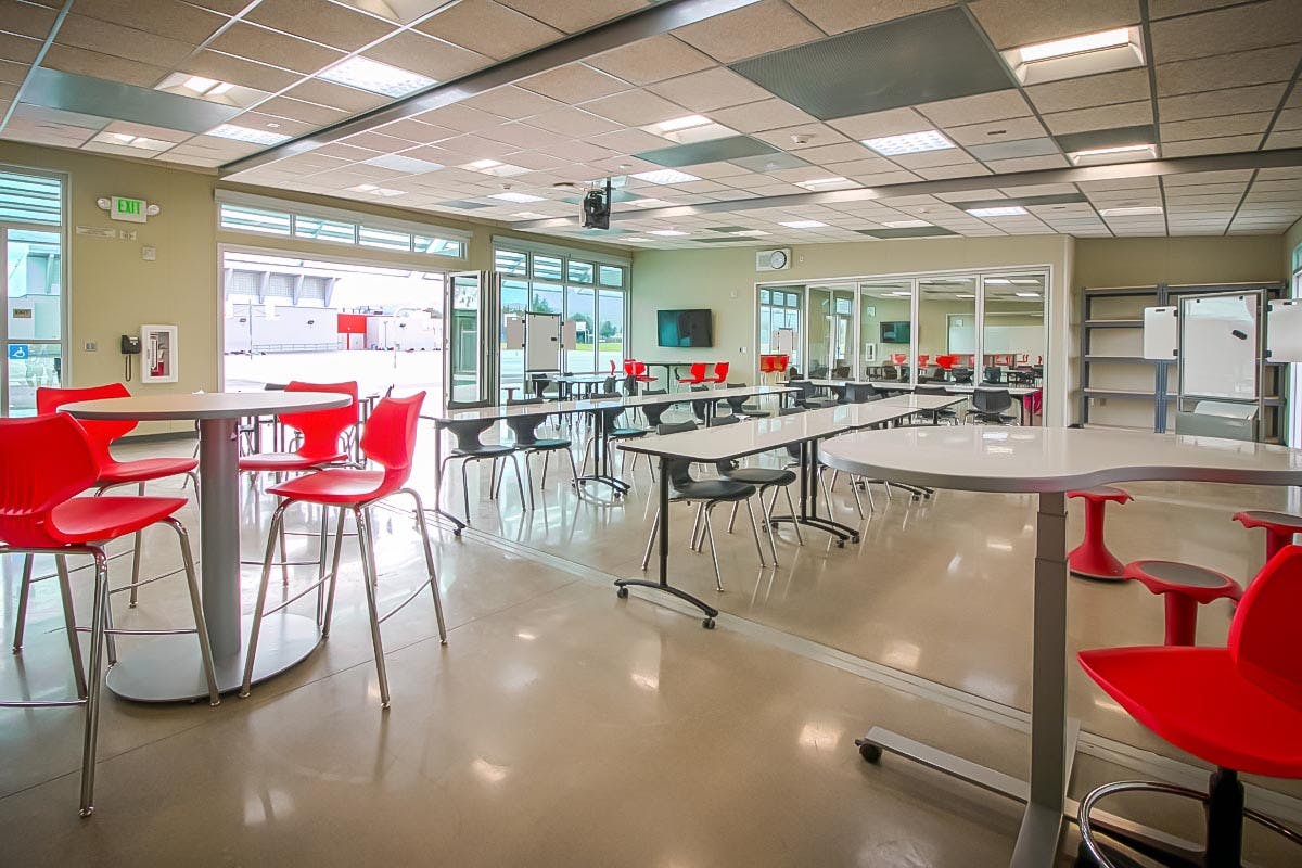 flexibility, natural daylight and fresh air in 21st Century classroom design created by interior and exterior folding glass walls