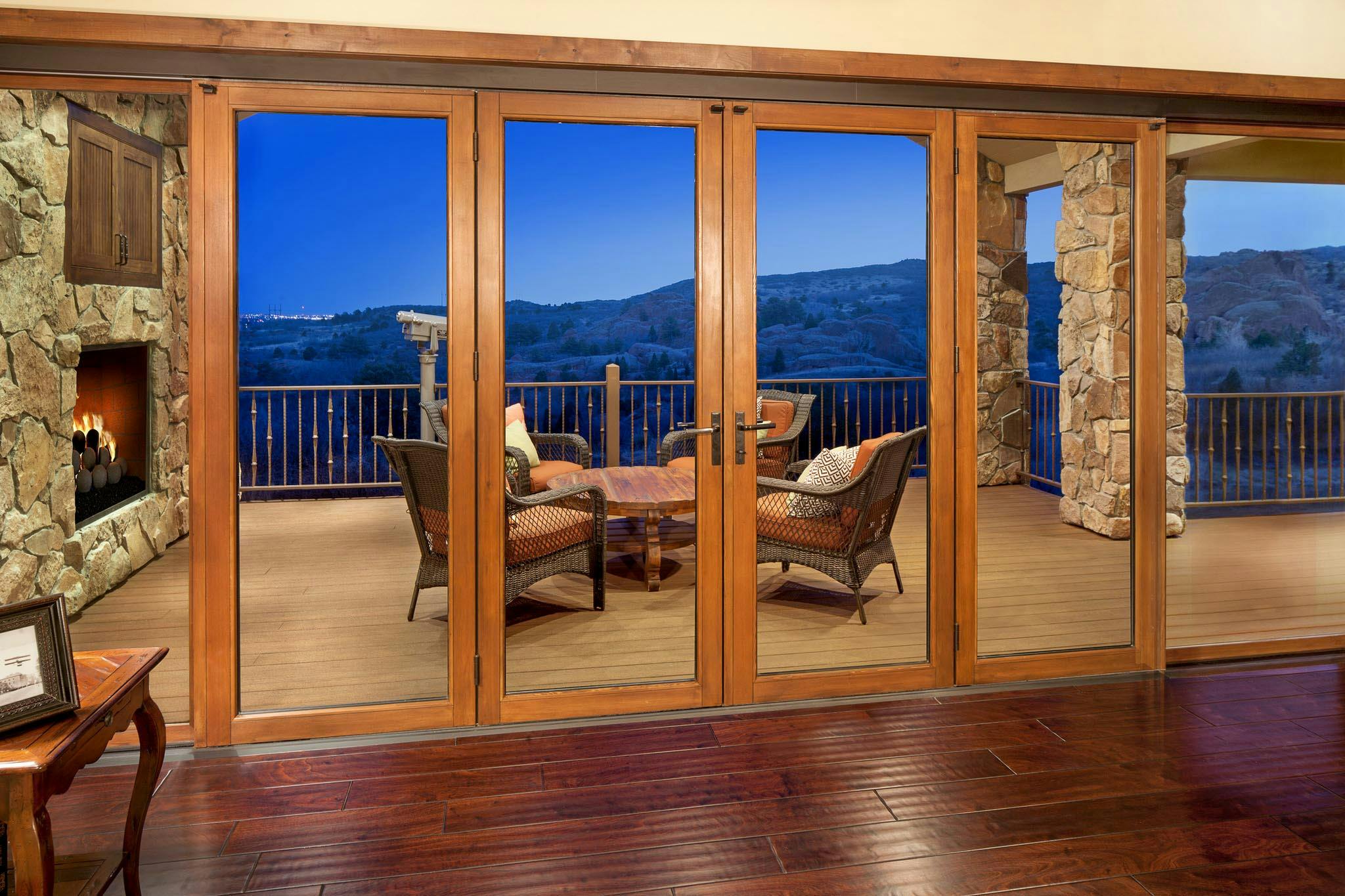 wood sliding glass wall with hillside view