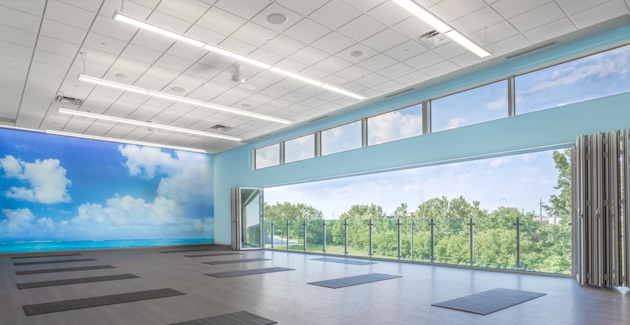 Fitness center design for health and wellness with opening glass walls