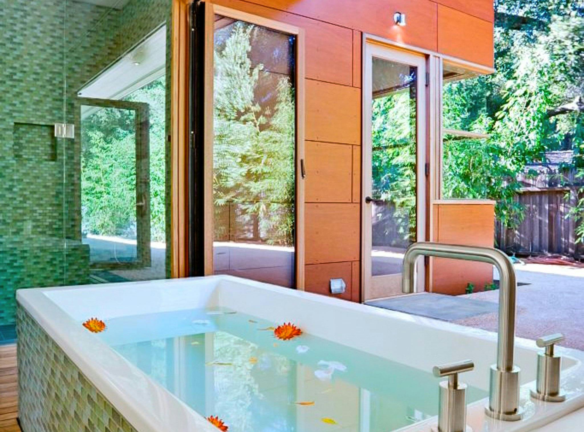 retractable glass doors in bathroom design