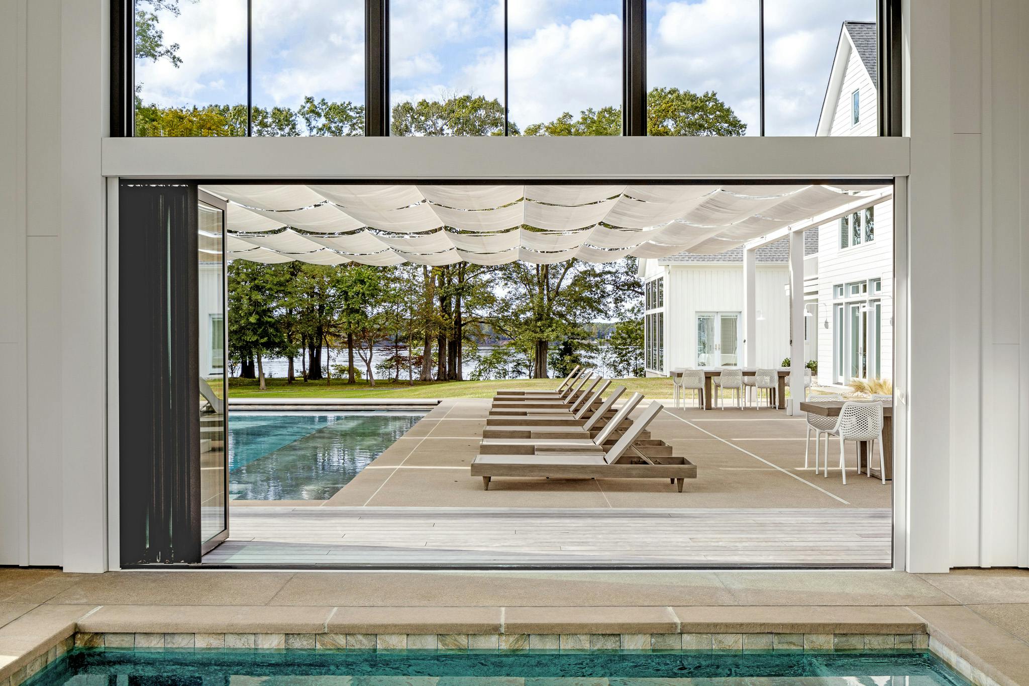 NanaWll folding glass doors create indoor outdoor pools