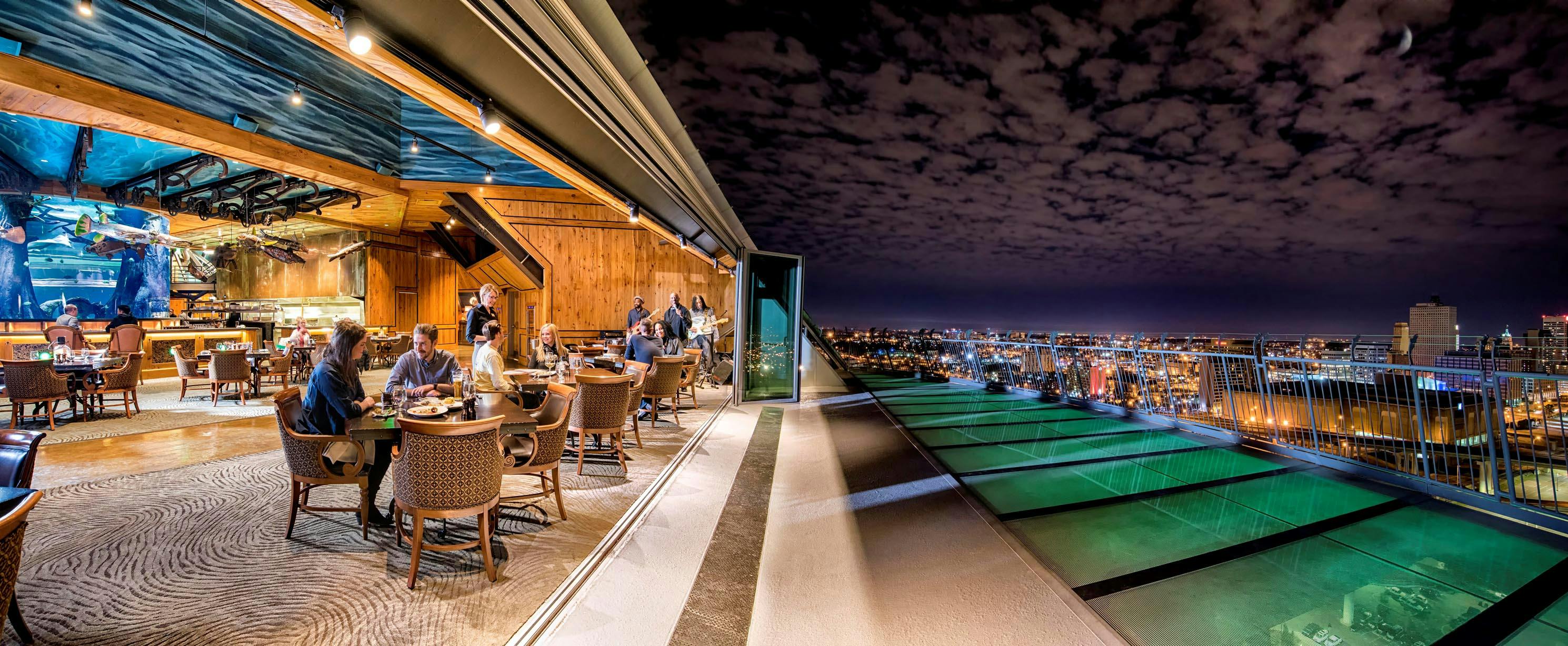 the best rooftop bars across america highligting the memphis pyramid with folding glass wall