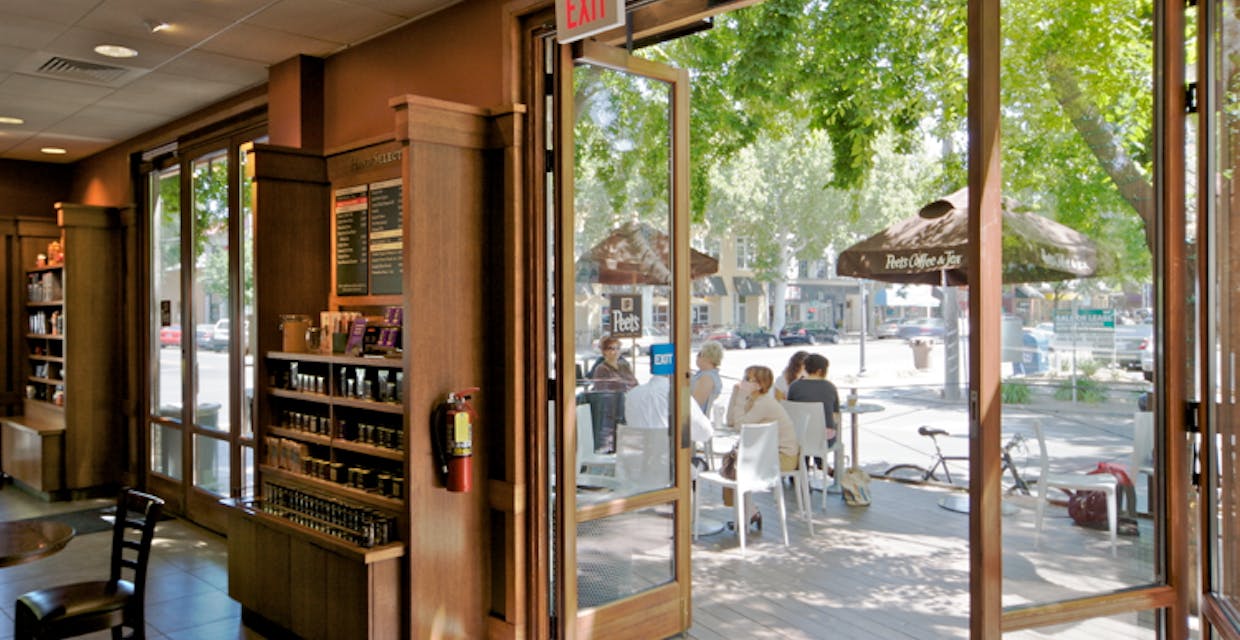 wood folding glass walls as the entrance doors at Peet's coffee