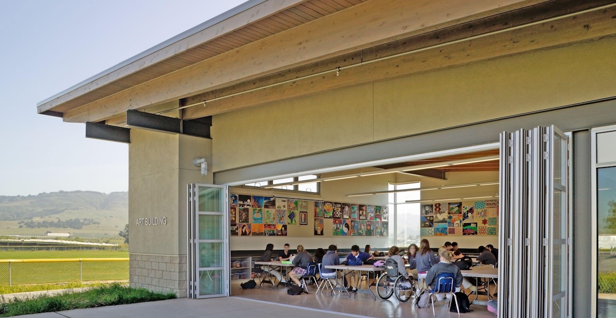 acoustic moveable glass walls allowing air flow and natural daylight to interior school design