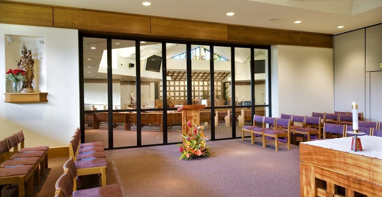 religious interior room with interior moveable glass systems used as interior divisions within institution  