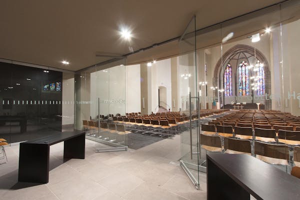 prayer room interior with frameless interior moveable glass systems 