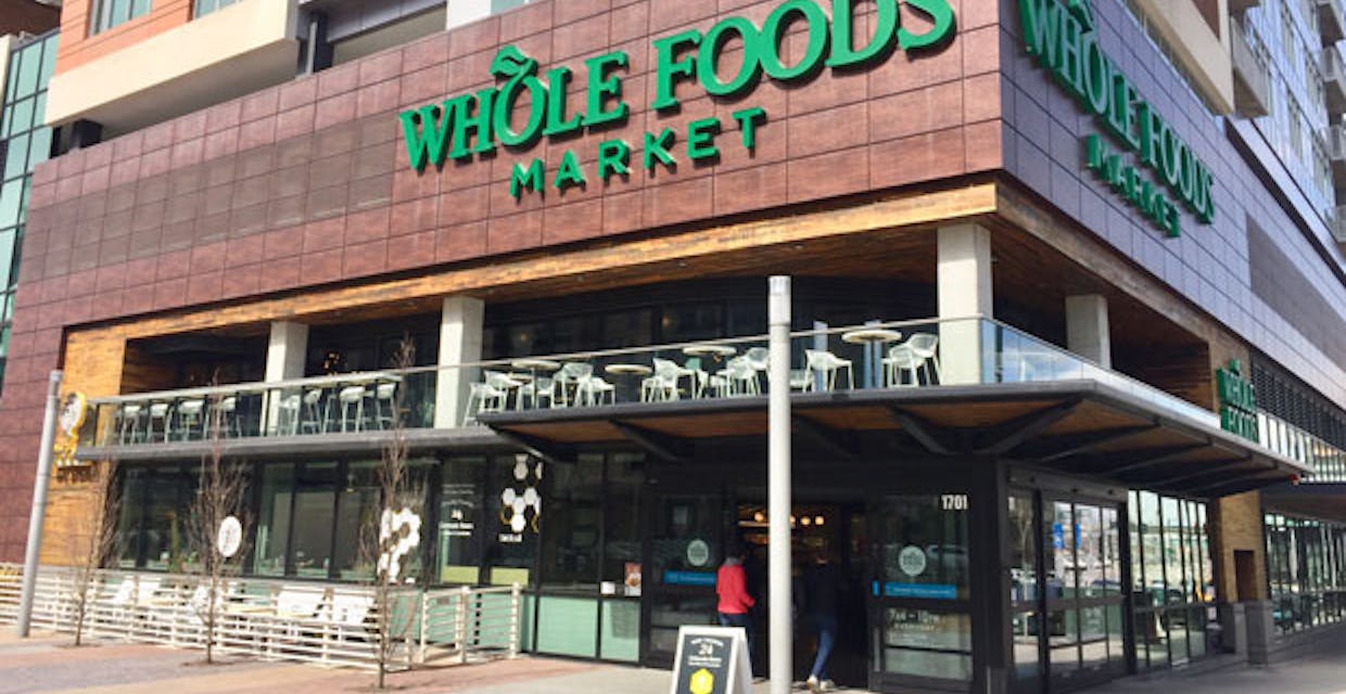 whole foods retail exterior with sliding glass walls