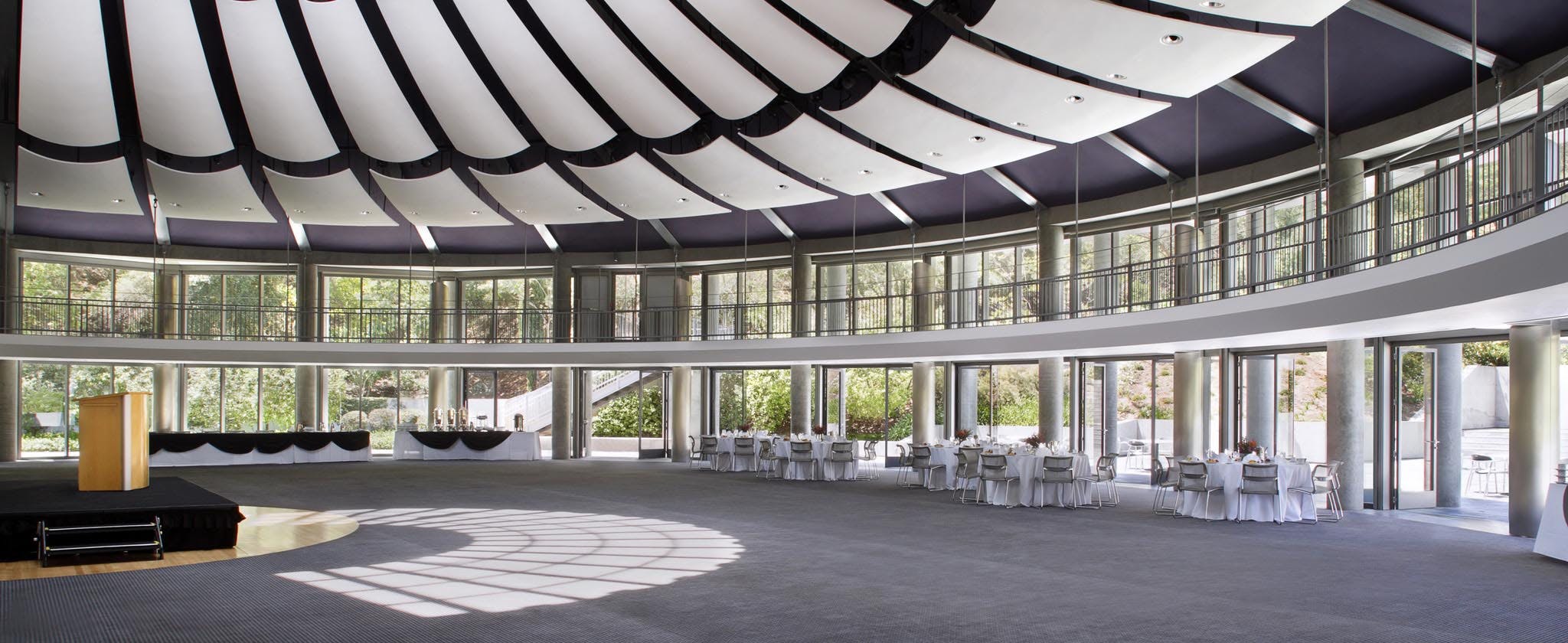 exterior commercial opening glass walls in religious institution for fresh air and daylight