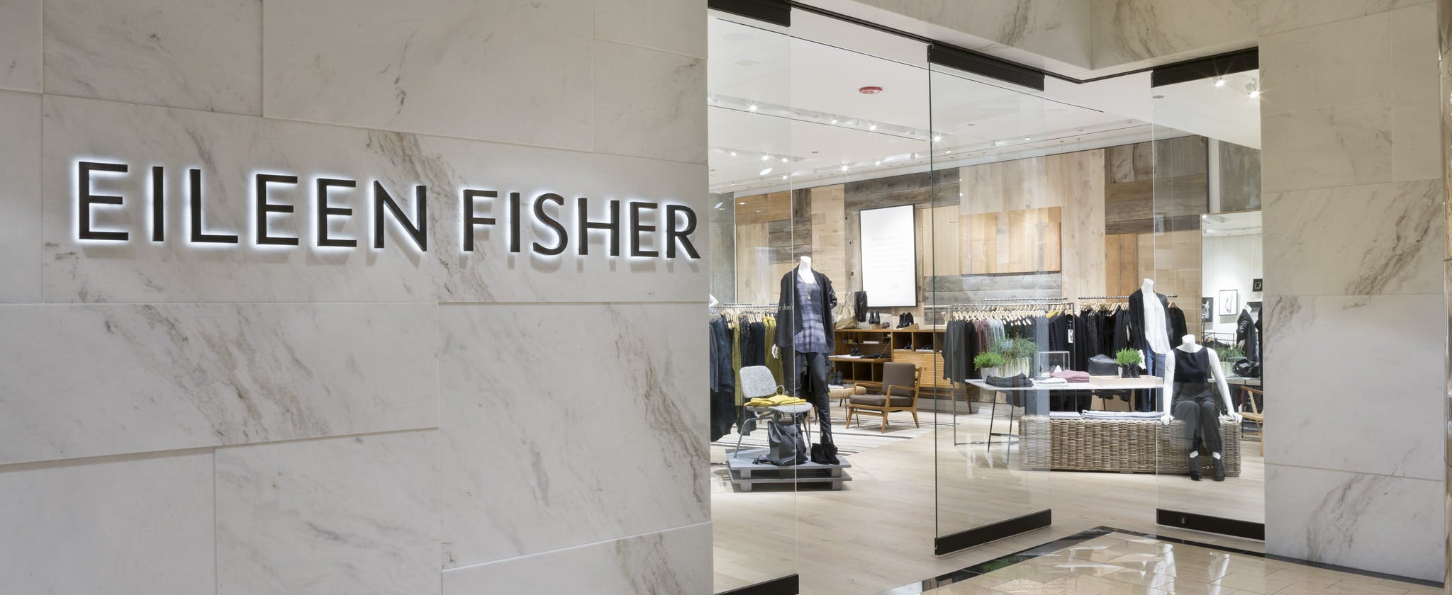 interior commercial glass systems used as retail storefront at Eileen Fisher in indoor mall
