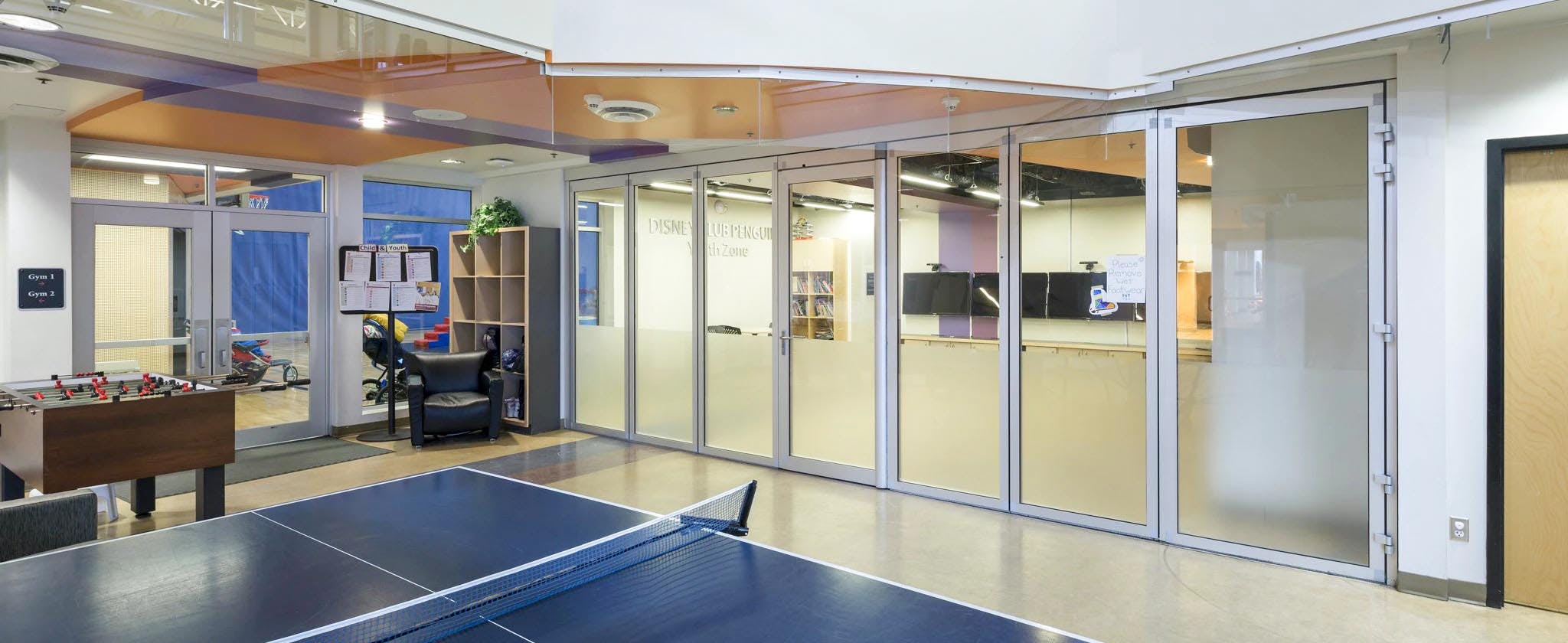 game room near aluminum framed moveable interior glass doors at community center